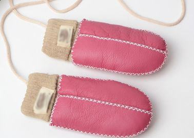 Porcellana Guanti della pelle di pecora del bambino cuciti mano più calda con il polsino rosa-chiaro fornitore